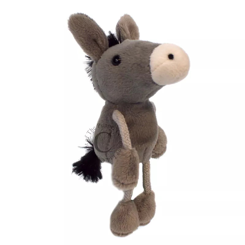 A kids' finger puppet show featuring a grey The Puppet Company Donkey.