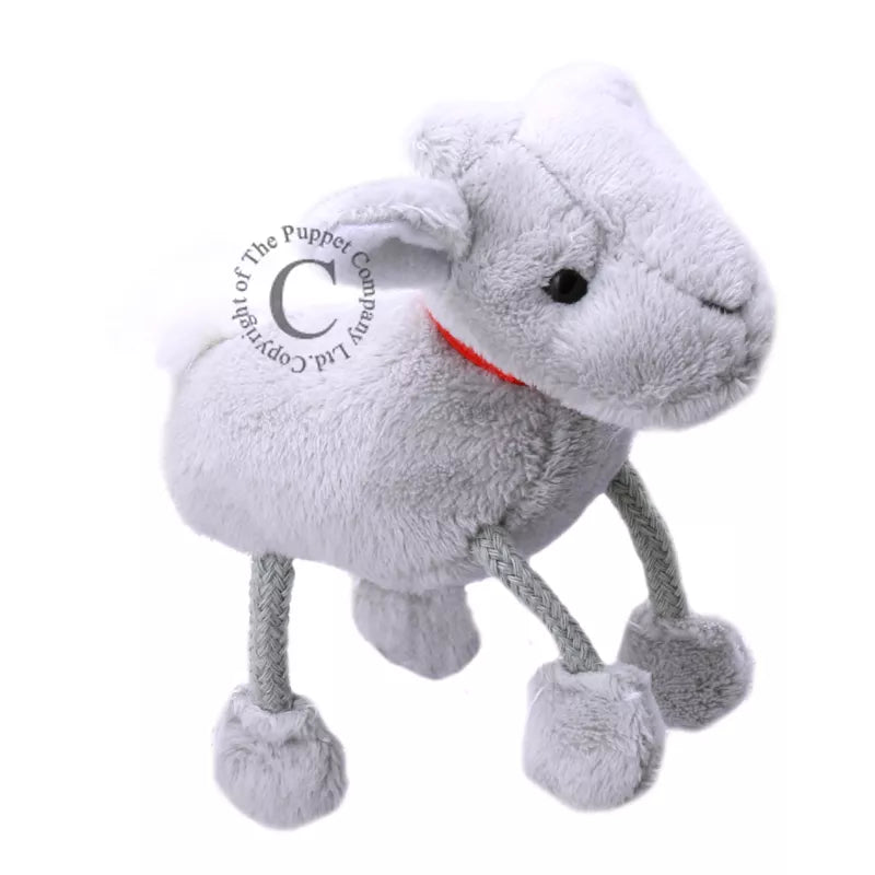 A grey goat puppet is standing on a white background.