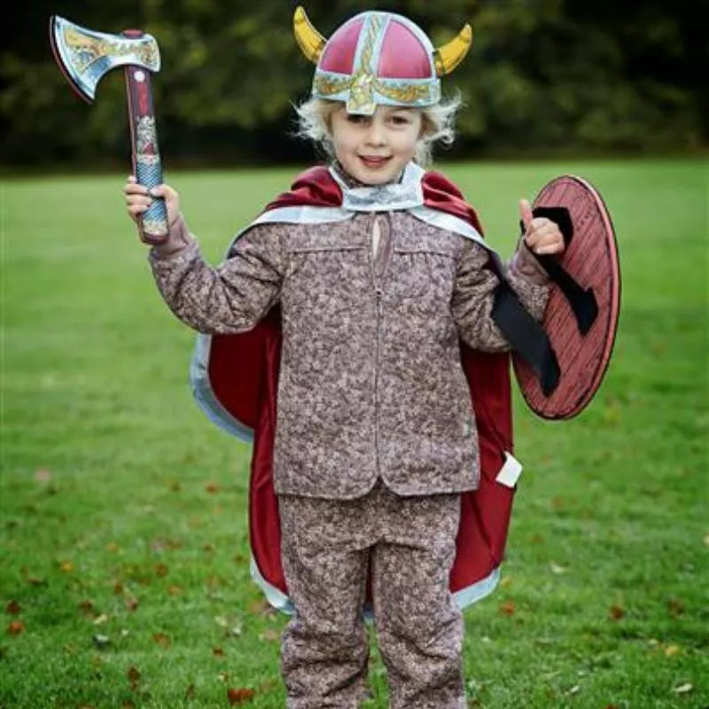 A little boy in a Liontouch Viking Cape holding an axe.
