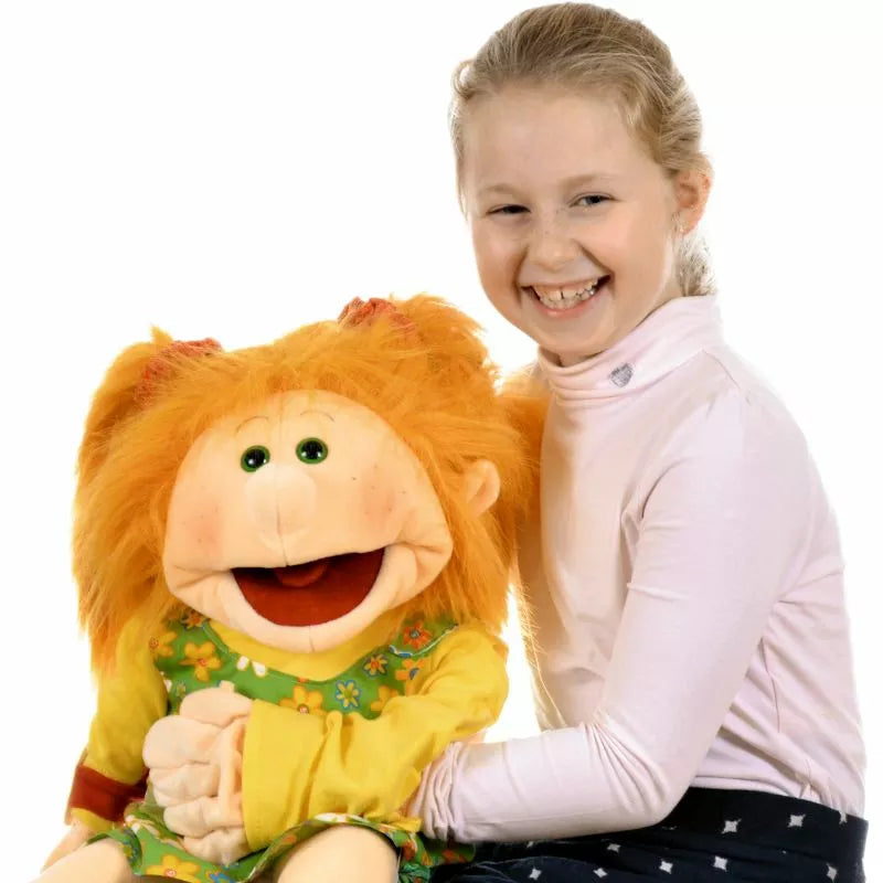 A young girl showcasing her puppet show skills with a Living Puppets Marleen 65cm Hand Puppet, delighting kids with its vibrant orange hair.