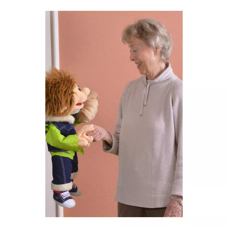 A woman is performing a puppet show with the Living Puppets Gerrit 65cm Hand Puppet for kids.