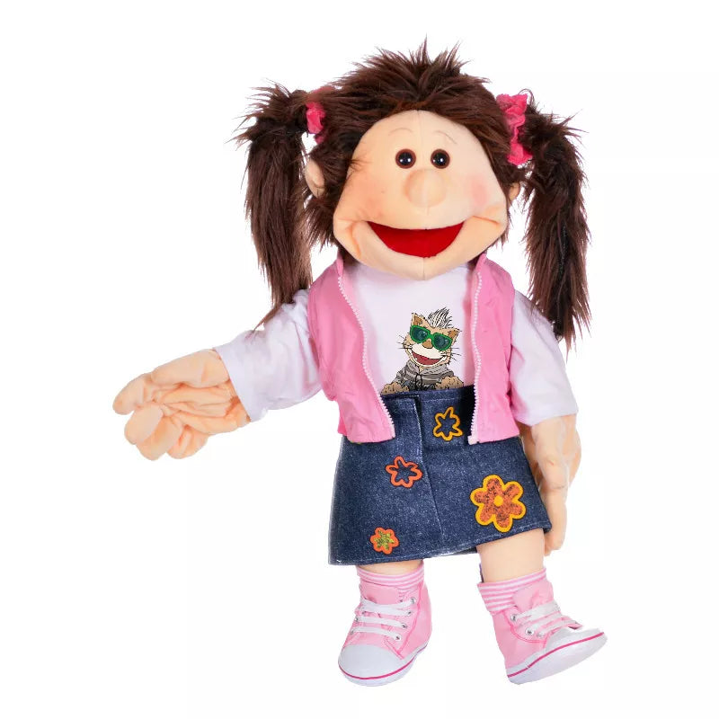 A 65cm brown-haired puppet named Monique with a pink skirt, perfect for kids' puppet shows.